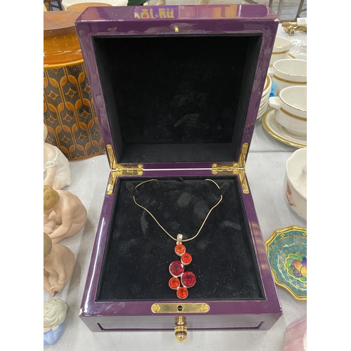 288 - A NECKLACE WITH A LARGE 'CHERRY' DESIGN PENDANT IN PRESENTATION BOX