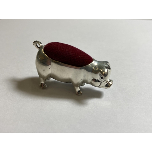 608 - A MINIATURE SILVER PIG PIN CUSHION