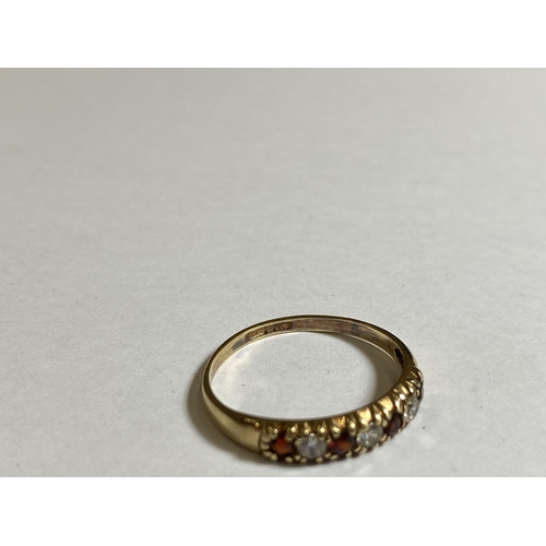 614 - A 9CT YELLOW GOLD RED STONE & CZ RING, WEIGHT 1.2G