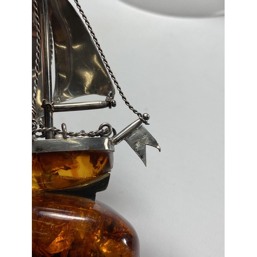 654 - A BALTIC AMBER & SILVER SHIP MODEL IN A GLASS DOME