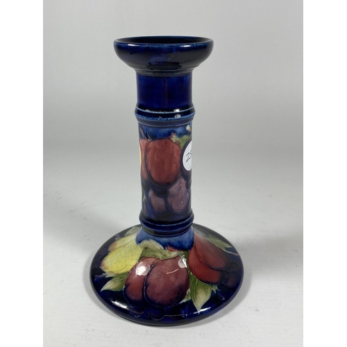 728A - A MOORCROFT 'WISTERIA' BERRY PATTERN SHORT CANDLESTICK