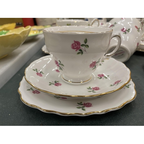 822 - A COLCLOUGH ROSE PATTERNED TEA SET TO INCLUDE CAKE PLATES, CUPS, SAUCERS, SIDE PLATES, SUGAR BOWL AN... 