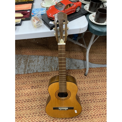 889 - AN ACOUSTIC GUITAR