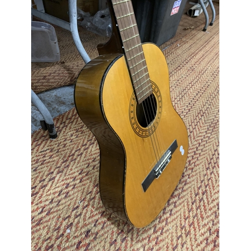 889 - AN ACOUSTIC GUITAR