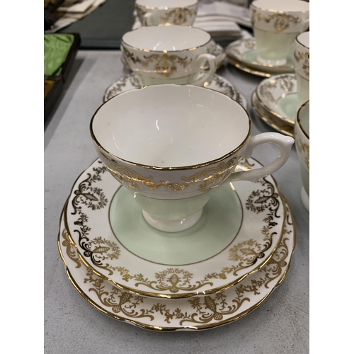 891 - A SUTHERLAND PALE GREEN AND GILT PART TEASET TO INCLUDE CUPS, SAUCERS, SIDE PLATES, CREAM JUG AND SU... 