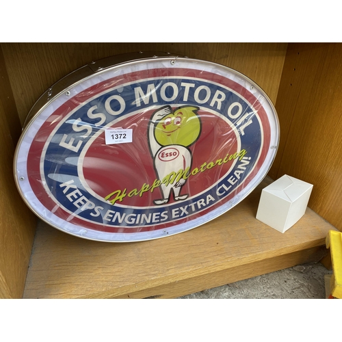 1372 - AN ILLUMINATED OVAL 'ESSO MOTOR OIL' SIGN WITH PLUG AND LEAD