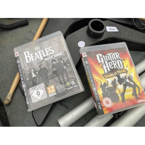 2080 - A PLAYSTATION DRUM KIT AND TWO GAMES TO INCLUDE GUITAR HERO WORLD TOUR