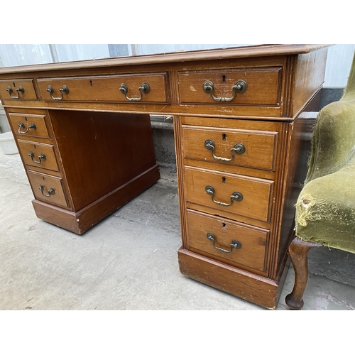 2223 - AN EDWARDIAN TWIN-PEDESTAL DESK ENCLOSING NINE DRAWERS, 48X26