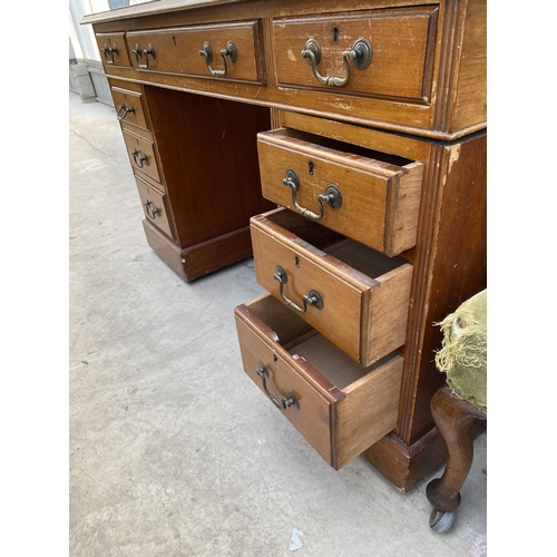 2223 - AN EDWARDIAN TWIN-PEDESTAL DESK ENCLOSING NINE DRAWERS, 48X26