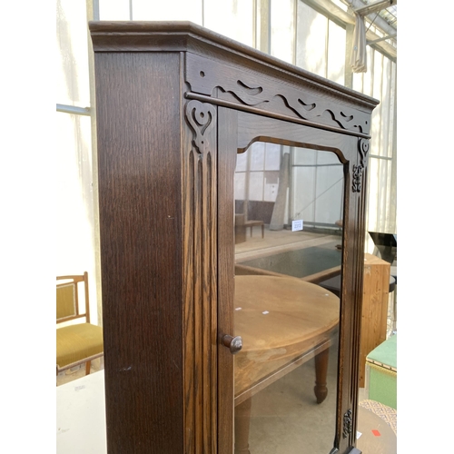 2313 - A MODERN OAK GLAZED CORNER CUPBOARD WITH CUPBOARD TO THE BASE