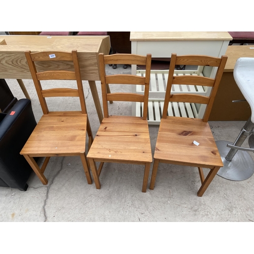 2455 - THREE MODERN PINE DINING CHAIRS