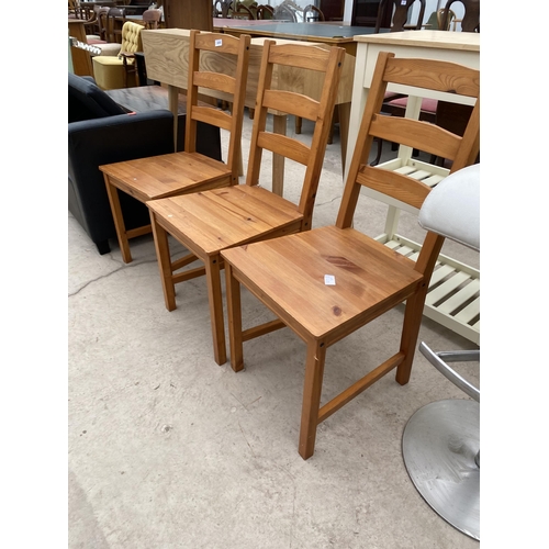 2455 - THREE MODERN PINE DINING CHAIRS