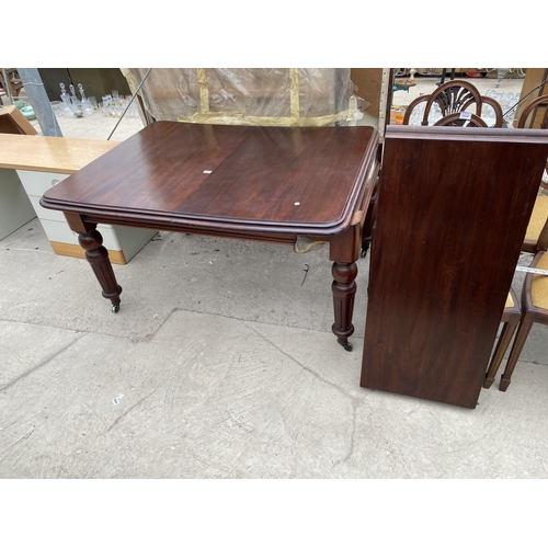 2507 - A VICTORIAN MAHOGANY WIND OUT DINING TABLE ON TURNED AND FLUTED LEGS 53