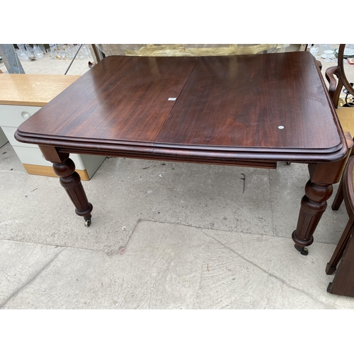 2507 - A VICTORIAN MAHOGANY WIND OUT DINING TABLE ON TURNED AND FLUTED LEGS 53