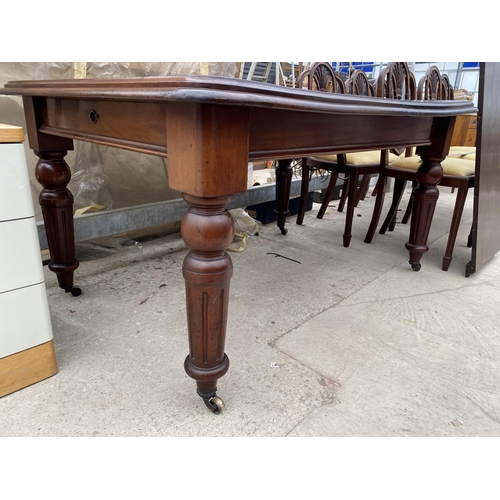 2507 - A VICTORIAN MAHOGANY WIND OUT DINING TABLE ON TURNED AND FLUTED LEGS 53