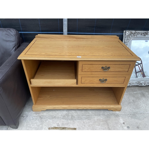 2535 - AN OAK CABINET WITH TWO DRAWERS AND SLIDE OUT SHELF