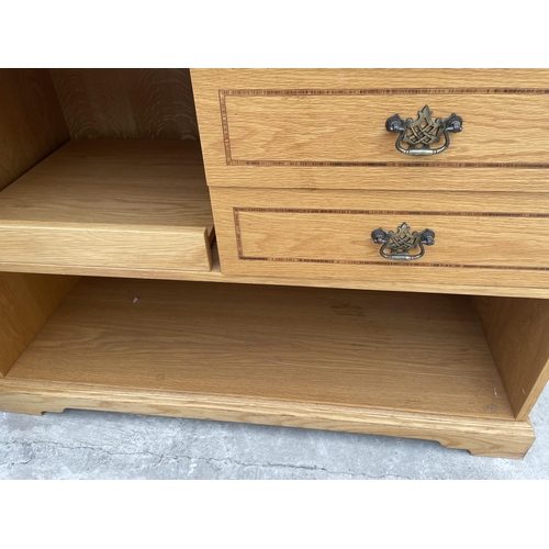 2535 - AN OAK CABINET WITH TWO DRAWERS AND SLIDE OUT SHELF