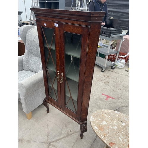 2579 - A VICTORIAN OAK TWO DOOR GLAZED CORNER CUPBOARD ON OPEN BASE, 28