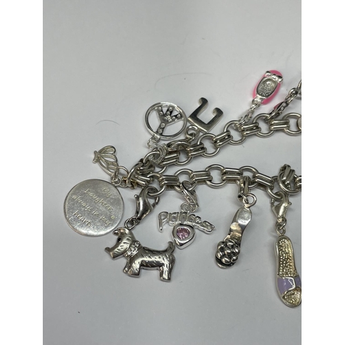 611 - A SILVER CHARM BRACELET WITH TWELVE VARIOUS CHARMS