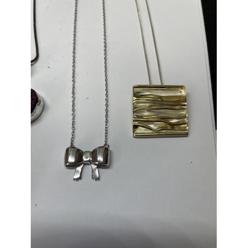 614 - FOUR SILVER NECKLACES WITH PENDANTS