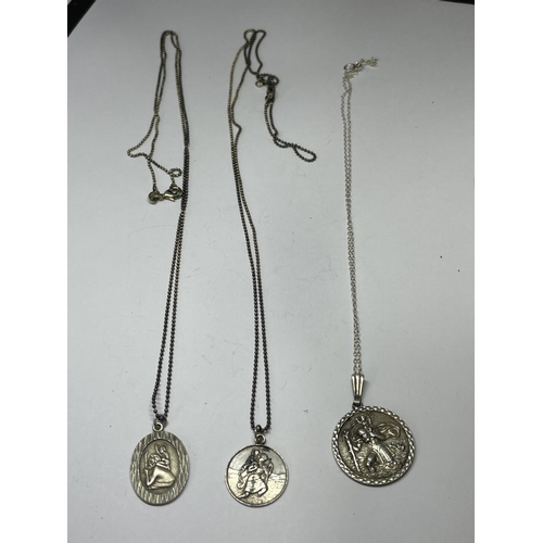 626 - THREE SILVER NECKLACES WITH ST CHRISTOPHER PENDANTS