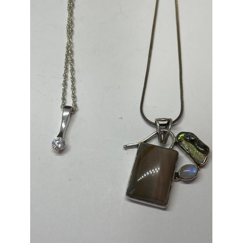 627 - FOUR SILVER NECKLACES WITH PENDANTS