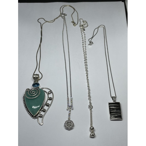 633 - FOUR SILVER NECKLACES WITH PENDANTS