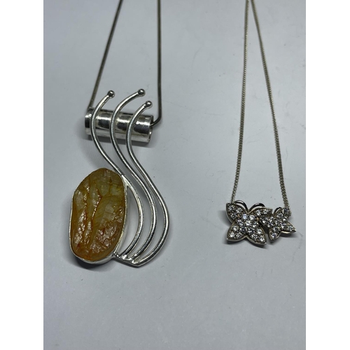 661 - FOUR SILVER NECKLACES WITH PENDANTS