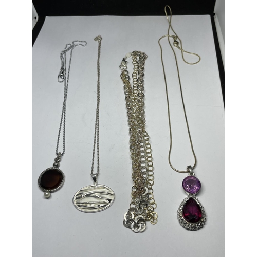 670 - FOUR SILVER NECKLACES WITH PENDANTS