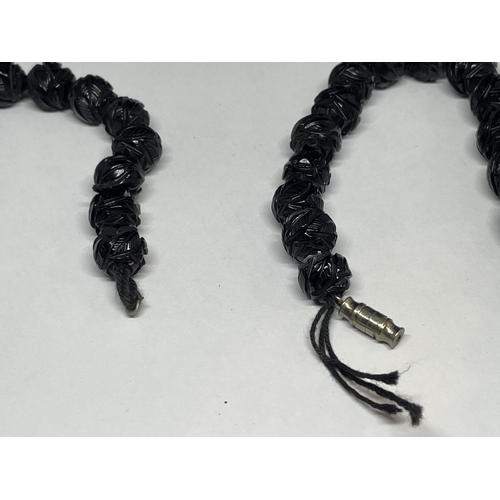 520 - A CARVED WHITBY JET GRADUATED NECKLACE