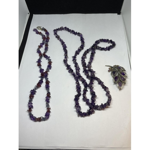 534 - THREE PURPLE STONE ITEMS POSSIBLY AMETHYST TO INCLUDE A BROOCH AND TWO NECKLACES