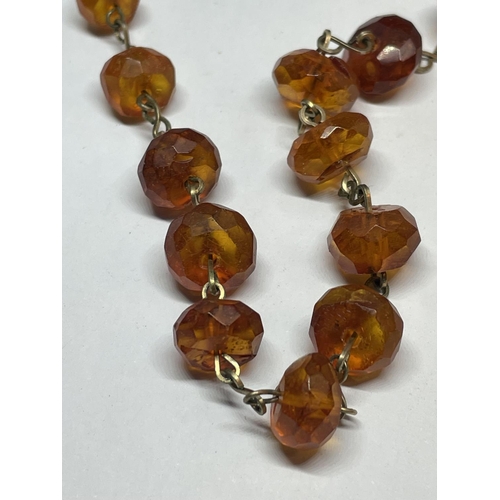 536 - AN AMBER EFFECT NECKLACE