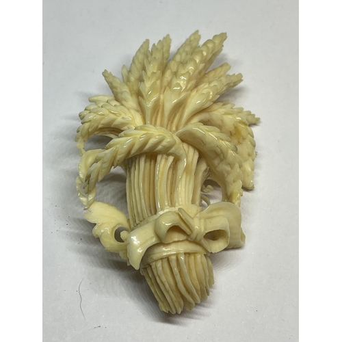 537 - TWO CARVED BONE BROOCHES IN A WHEATSHEAF DESIGN WITH A PRESENTATION BOX