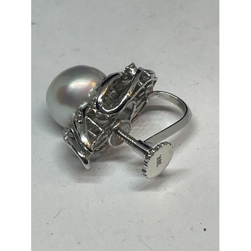 541 - A 14 CARAT WHITE GOLD, DIAMOND AND PEARL EARRING