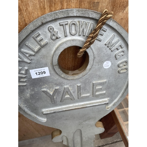 1209 - A CAST METAL YALE WALL HANGING KEY