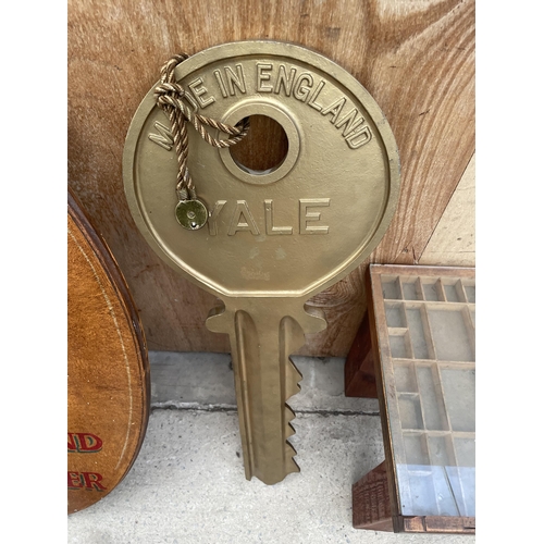 1209 - A CAST METAL YALE WALL HANGING KEY