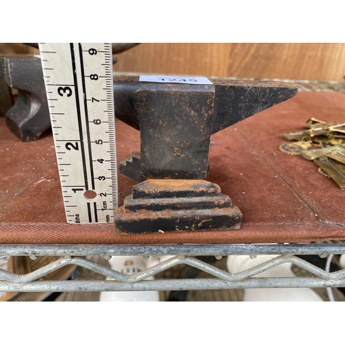 1245 - A MINITURE CAST IRON ANVIL