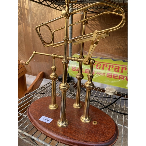 1279 - A VINTAGE BRASS WINE BOTTLE TILTER WITH WOODEN PLINTH BASE