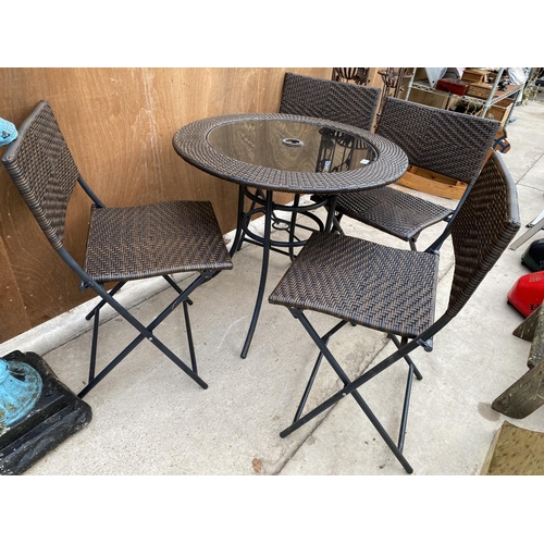 1282 - A RATTAN FIVE PIECE BISTRO SET TO INCLUDE ROUND TABLE AND FOUR CHAIRS