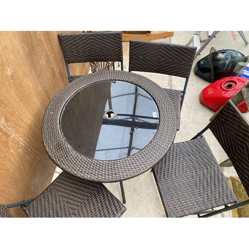 1282 - A RATTAN FIVE PIECE BISTRO SET TO INCLUDE ROUND TABLE AND FOUR CHAIRS