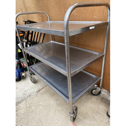 1294 - A STAINLESS STEEL FOUR WHEELED THREE TIER TROLLEY