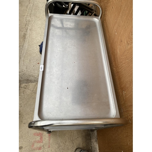 1294 - A STAINLESS STEEL FOUR WHEELED THREE TIER TROLLEY