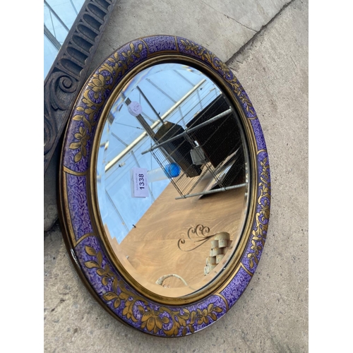 1338 - TWO DECORATIVE OAK FRAMED MIRRORS AND A FURTHER OVAL FRAMED MIRROR