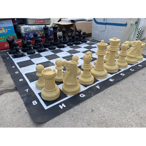 1363 - AN OUTDOOR CHESS SET WITH CHESS BOARD MAT