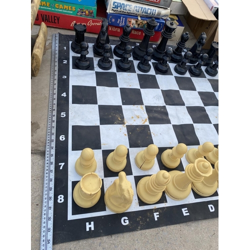 1363 - AN OUTDOOR CHESS SET WITH CHESS BOARD MAT