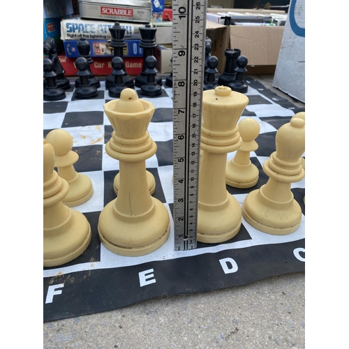 1363 - AN OUTDOOR CHESS SET WITH CHESS BOARD MAT