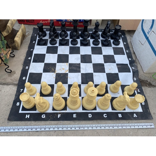 1363 - AN OUTDOOR CHESS SET WITH CHESS BOARD MAT