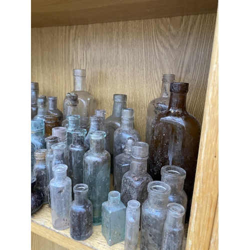 1411 - A LARGE QUANTITY OF MINITURE GLASS MEDICINE BOTTLES