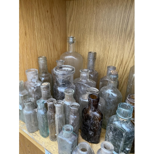 1411 - A LARGE QUANTITY OF MINITURE GLASS MEDICINE BOTTLES