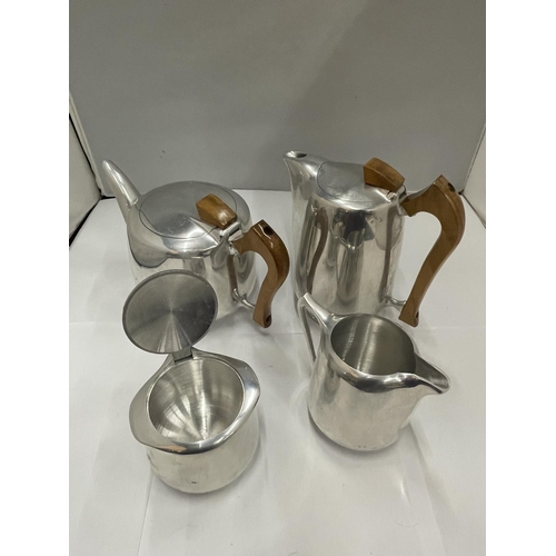 148 - A PICQUOT WARE STAINLESS STEEL TEAPOT, COFFEE POT, SUGAR BOWL AND CREAM JUG